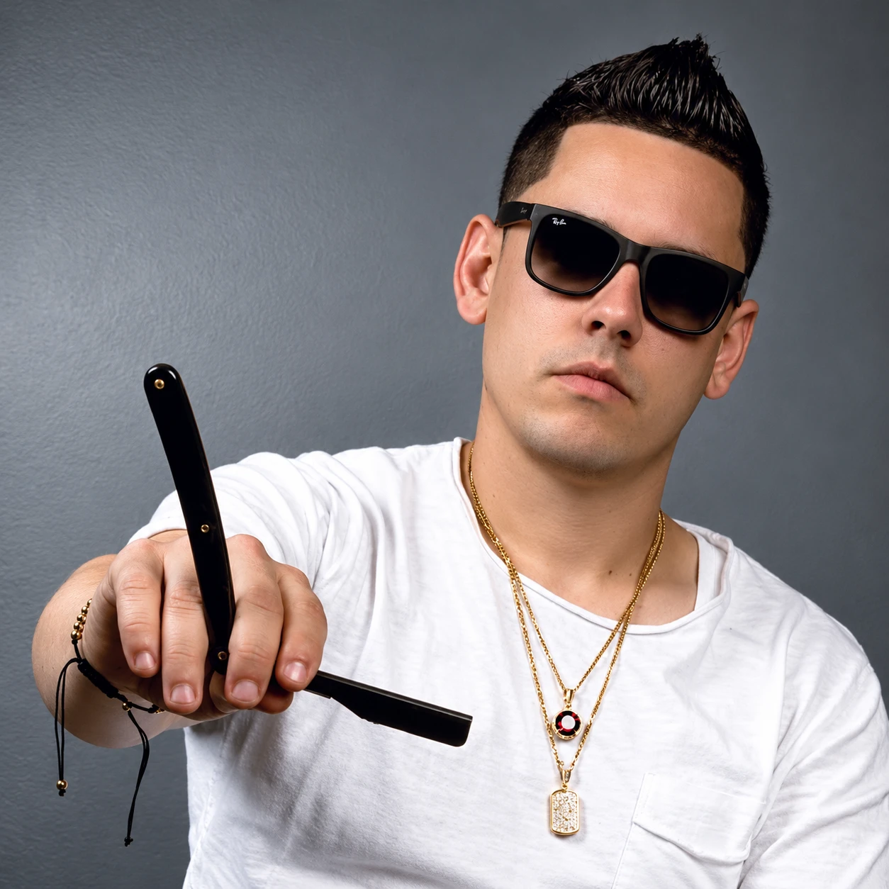 Trinidad Corrales holding a straight razor